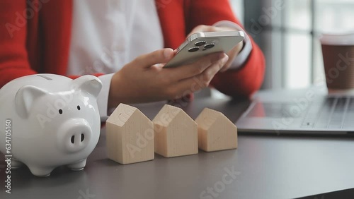 saving money and accounting concept. business man putting coin insert to jar and make acounting book for finance management to investment and saving. photo