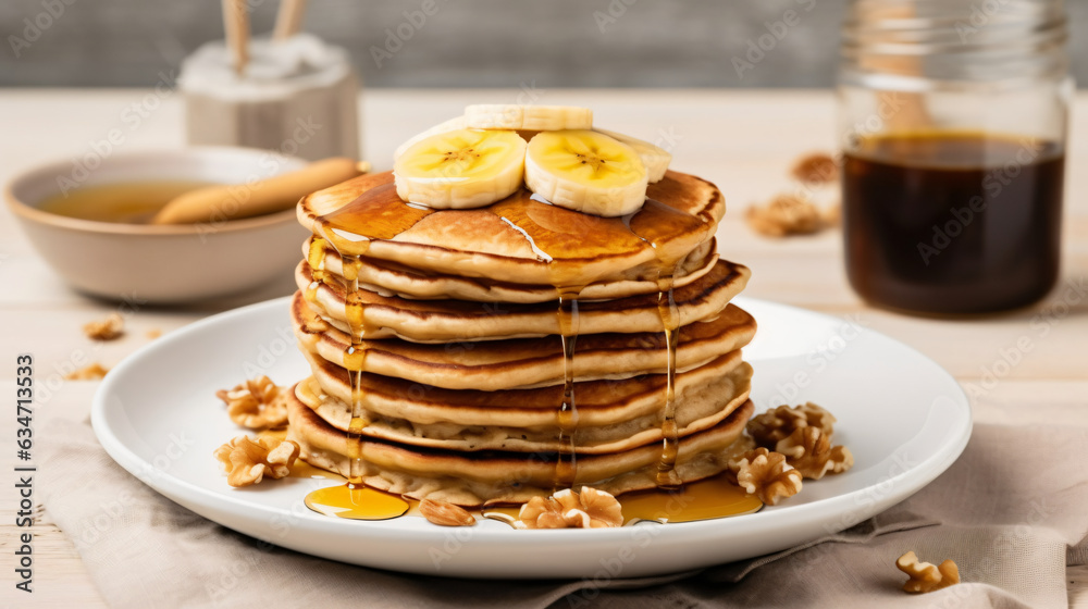 A stack of oatmeal banana pancakes topped with fresh banana slices, walnuts, and honey, accompanied by a cup of tea on a white wooden background. A nutritious breakfast. Space for copy. generative AI A stack of oatmeal banana pancakes topped with fresh banana slices, walnuts, and honey, accompanied by a cup of tea on a white wooden background. A nutritious breakfast. Space for copy. generative AI