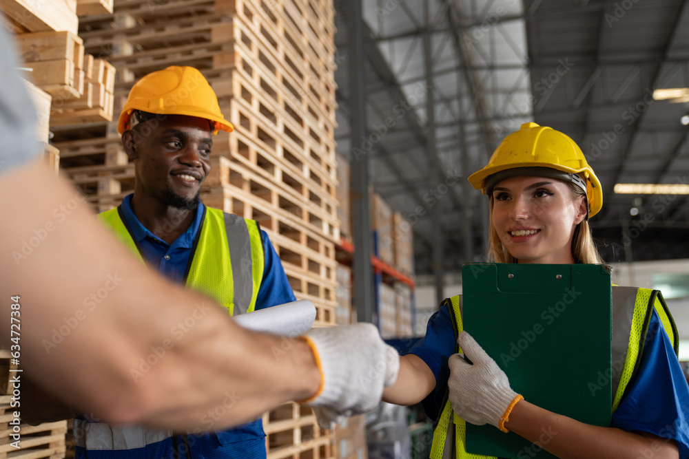 Technician shaking hand after checking and inspecting at cargo for stack item for shipping. males worker checking the store factory. industry factory warehouse. Technician shaking hand after checking and inspecting at cargo for stack item for shipping. males worker checking the store factory. industry factory warehouse.