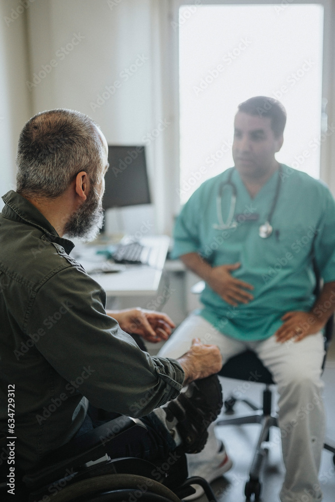 Male patient with disability visiting doctor at hospital