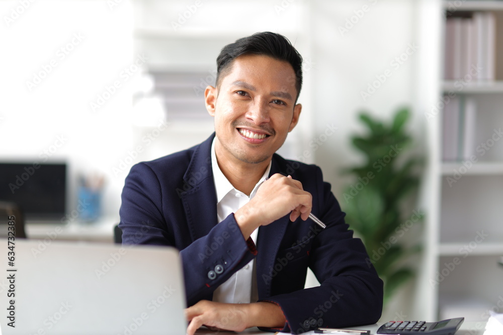 Portrait of a middle-aged businessman working in the office. Portrait of a middle-aged businessman working in the office.