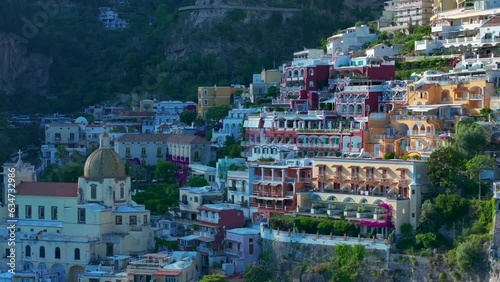 Wallpaper Mural Positano, tourist destination on the Amalfi Coast, Italy. Aerial view of Colorful houses on a Tyrrhenian sea coast seen through green juicy flora in Positano is a village in Naples metropolitan area Torontodigital.ca
