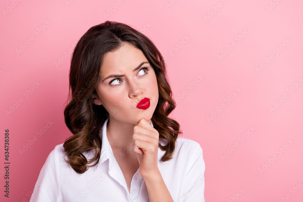 Photo of doubtful unsure young girl dressed white top looking empty space isolated pink color background Photo of doubtful unsure young girl dressed white top looking empty space isolated pink color background