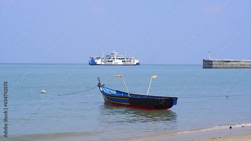 A Fishing Boat On The Beach And A Ferry In The Middle Of The Sea A Fishing Boat On The Beach And A Ferry In The Middle Of The Sea