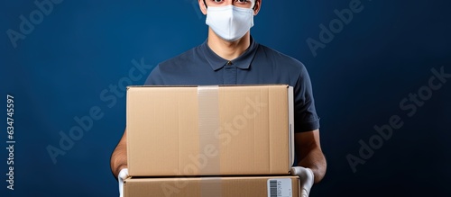 Delivery person with protective gear carrying boxes Fast and free online shopping with express delivery photo