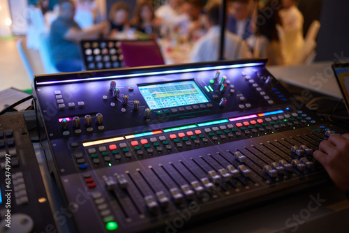 Sound mixer. Professional audio mixing console with lights, buttons, faders and sliders.