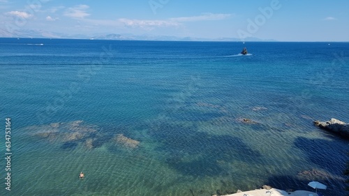 corflu pontikonisi small island boats ariplanes swimming girl greece photo