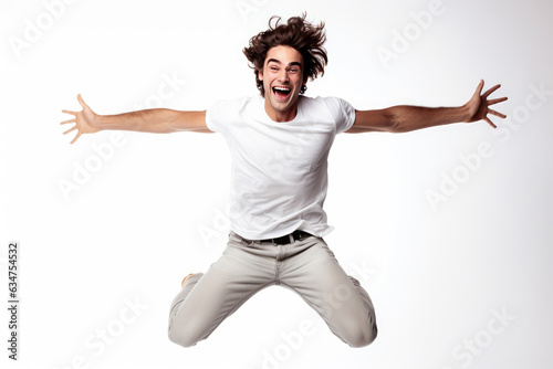 Beautiful Happy Man Jumping On White Background. Mans Happiness, Jumping Jubilance, Cheerful White Background, Exuberant Jumping, Joyful Expression, Beautiful Male Figure, Jump Of Joy photo