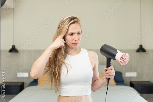 looking surprised, realizing a new thought, idea or concept. hair dryer concept