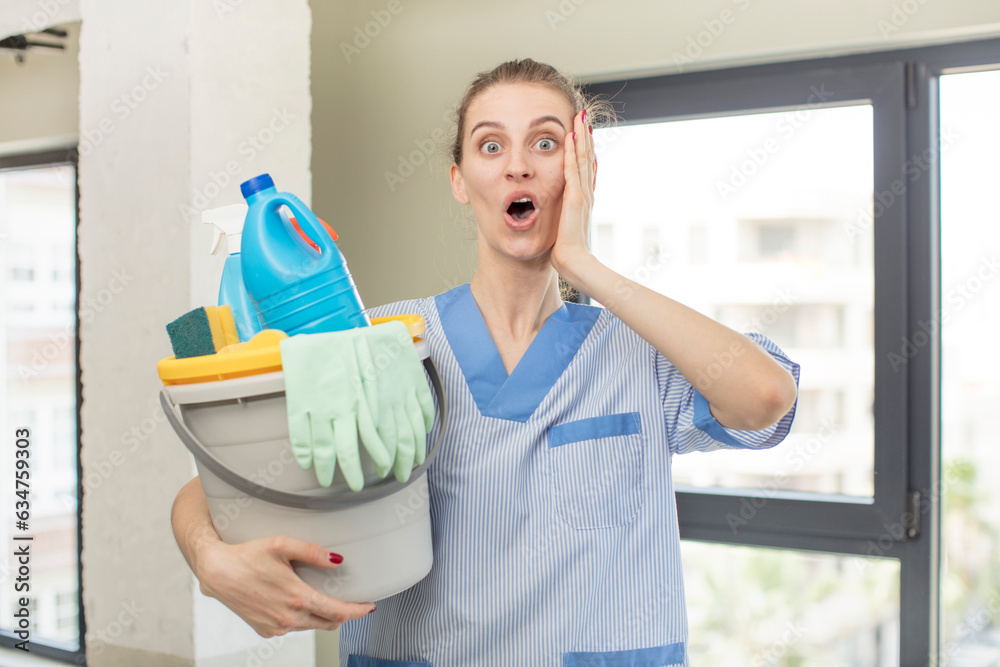 feeling extremely shocked and surprised. housekeeper concept feeling extremely shocked and surprised. housekeeper concept