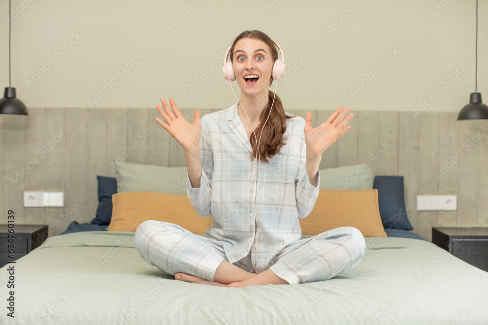 feeling happy and astonished at something unbelievable. bed time concept feeling happy and astonished at something unbelievable. bed time concept