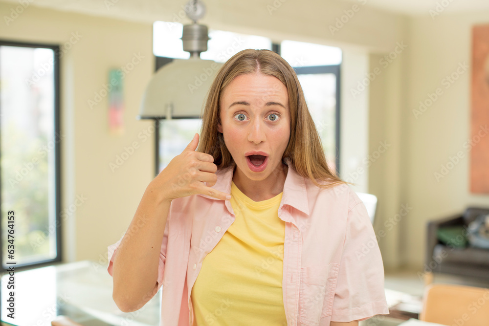 pretty blond woman crazy happily and cheerfully, waving hand, welcoming and greeting you, or saying goodbye pretty blond woman crazy happily and cheerfully, waving hand, welcoming and greeting you, or saying goodbye
