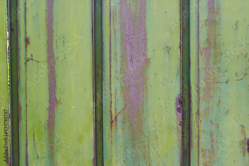 Abstract background green metal fence vertical stripes.