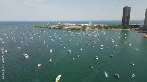 Drone Footage of Chicago skyline and lakefront with busy traffic and boats on a warm summer day