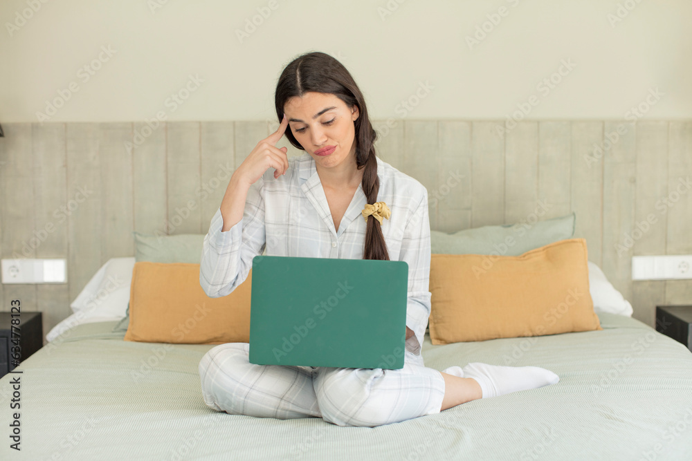 pretty young model looking surprised, realizing a new thought, idea or concept. rest and nightwear concept pretty young model looking surprised, realizing a new thought, idea or concept. rest and nightwear concept
