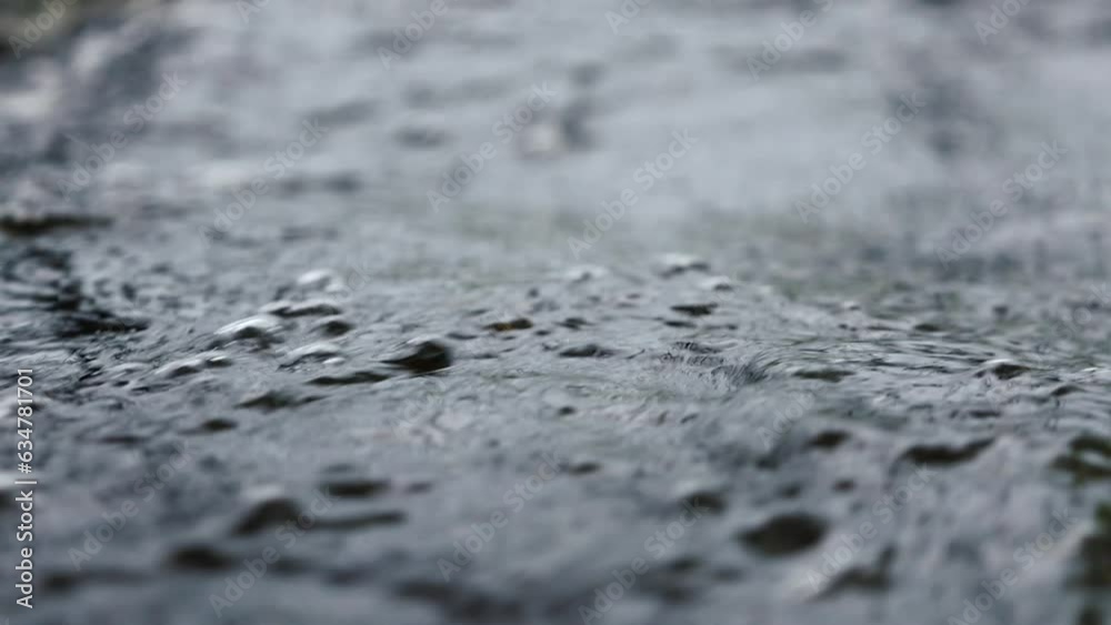 A Stream of Dark Bubbling Water Close-up, Slow Motion A Stream of Dark Bubbling Water Close-up, Slow Motion