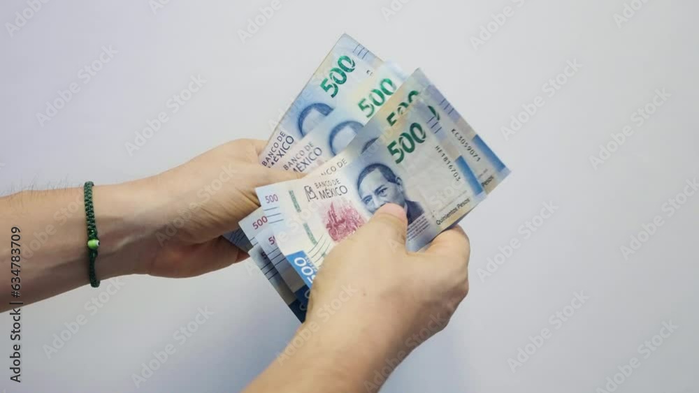Counting Wad of Mexican Bills. 500 Pesos