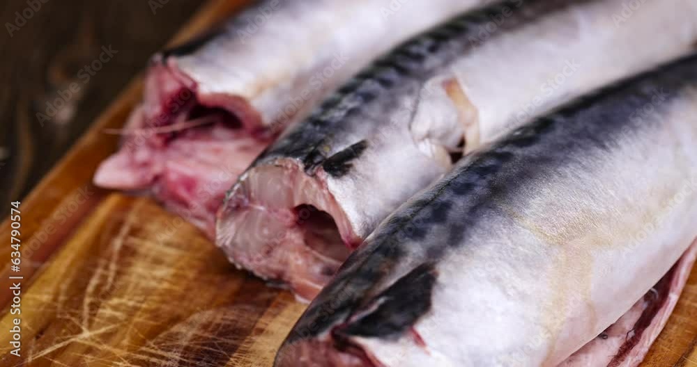 sliced mackerel during the preparation of a fish dish, raw butchered mackerel during cooking sliced mackerel during the preparation of a fish dish, raw butchered mackerel during cooking