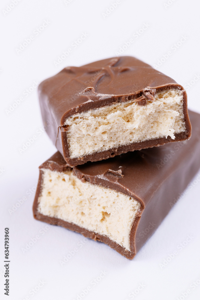 Chocolate bar with filling. Sweet chocolate bar broken into two pieces. Macro. Chocolate bar with filling. Sweet chocolate bar broken into two pieces. Macro.