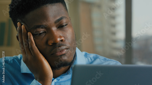 Canvas Print Tired multiracial businessman overworked computer laptop remote job drowsy exhau