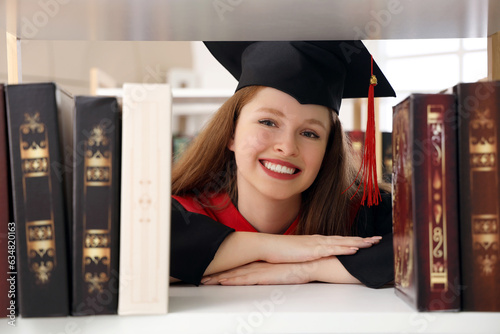Happy female graduate stude...