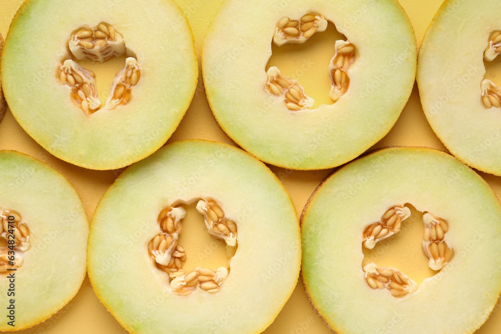 Slices of sweet melon on yellow background