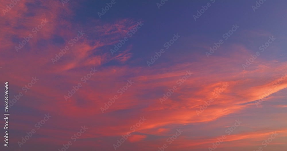 .Aerial view Red clouds float in the morning blue sky..colorful sky of sunset sunrise 4K Shooting With Drone..sweet pink cloud with purple shadow in blue sky during beautiful sunrise.Gradient color.