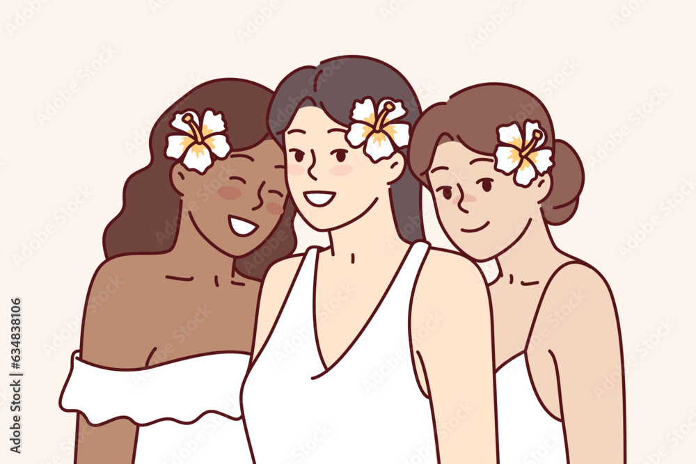 Diverse beautiful women with flowers in hair are dressed in elegant dresses for wedding ceremony. Three multicultural young bridesmaids at wedding ceremony or white party attendees