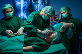 Professional surgeon team working and preparing equipment in the operating room.
