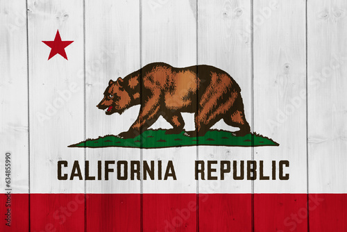 Flag of of USA state California on a textured background. Concept collage. photo