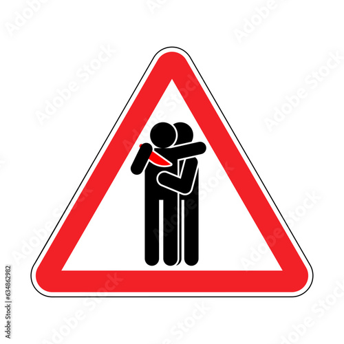 Attention traitor. Caution of betrayal. Red triangular road sign. Concept of betrayal is a knife in the back.