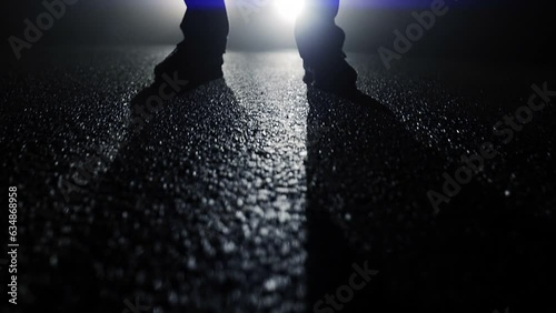 Silhouette of  Man Standing on Street at Night photo