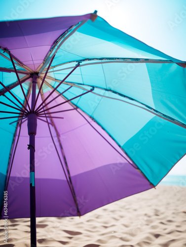 Close-up of sun umbrella at the beach, ultra minimalistic, colour blocking, light blue and purple colors photo