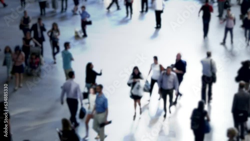 Crowds of pedestrians commuting on crowded urban road busy hectic fast speed