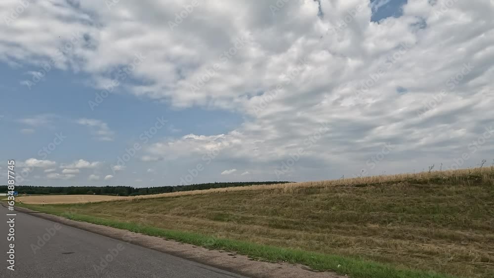 Road view on a summer day. Highways and cars, roadside and white road line markings. Road view on a summer day. Highways and cars, roadside and white road line markings.