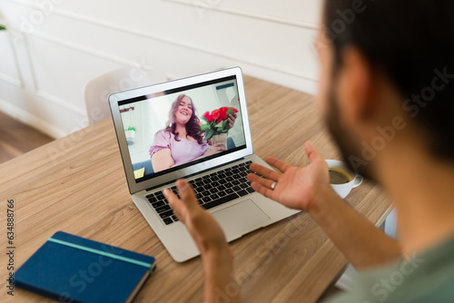 Happy couple in a long distance relationship having a virtual date