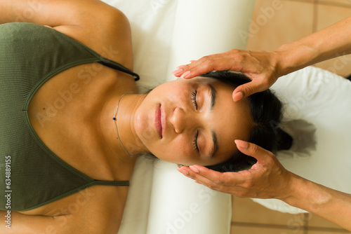 Photography Top view of a relaxing woman getting a head massage