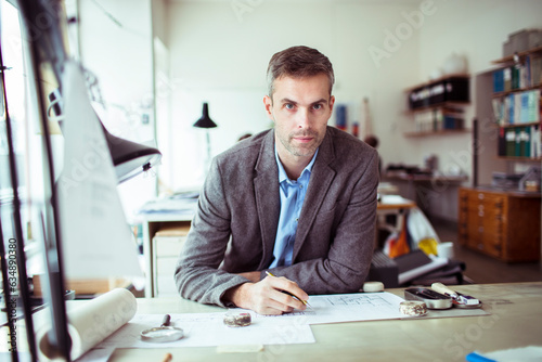Middle aged man working in a startup company office