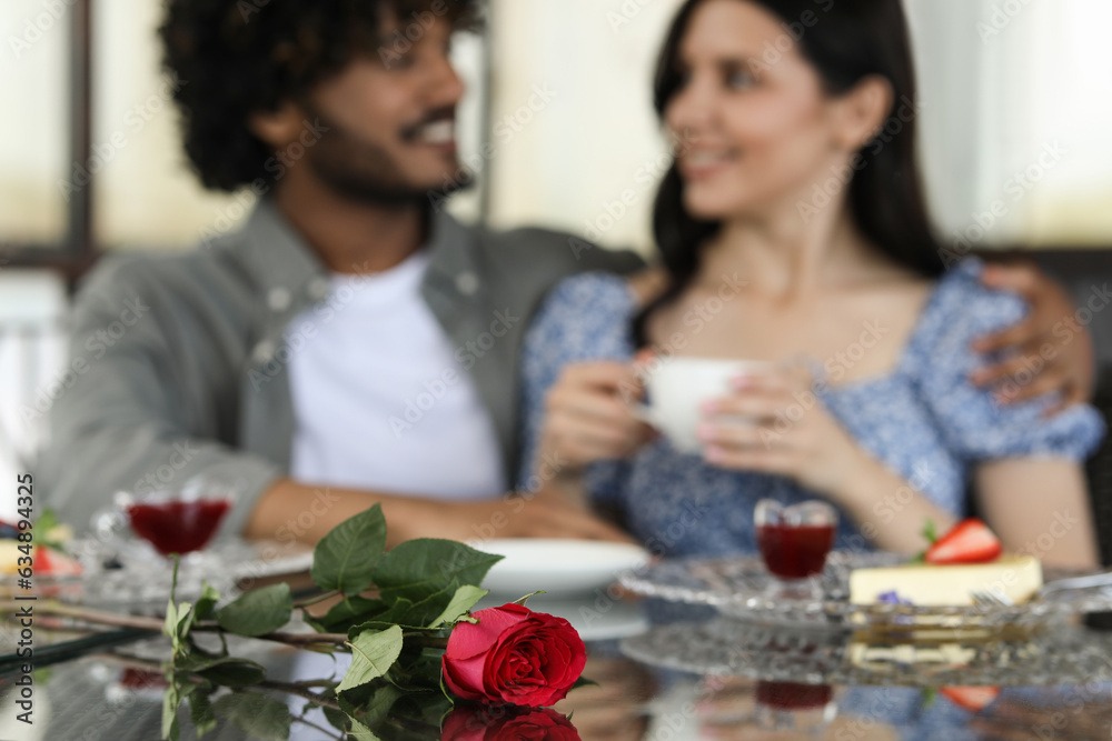 International dating. Happy couple spending time together in restaurant, selective focus International dating. Happy couple spending time together in restaurant, selective focus