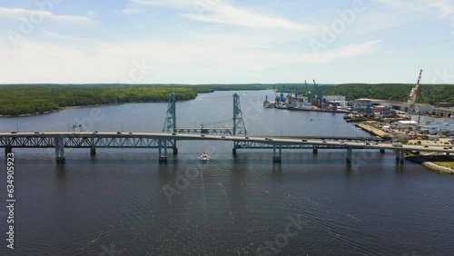 Drone footage showing Sagadahoc Bridge, and cars driving on the RTE1 in the city on Bath, Maine photo