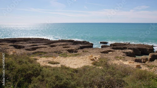 Panoramic View Of Calm Blue Waters Of The Atlantic Ocean From The Coast Of Algarve In Portugal. pan right
