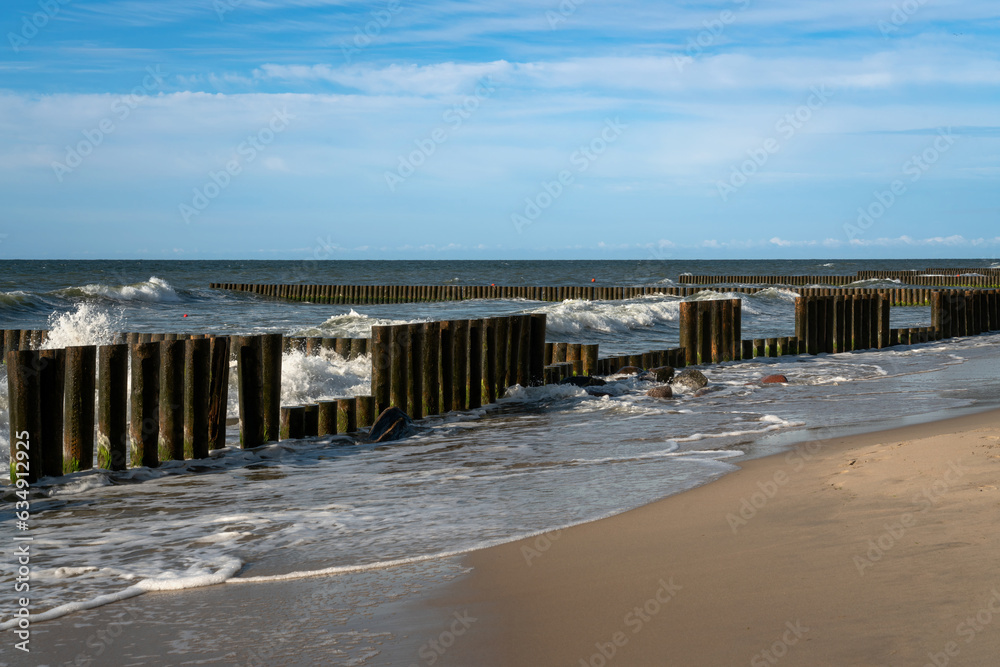 View of the Baltic Sea and wooden breakwaters of the city beach on a summer day, Svetlogorsk, Kaliningrad region, Russia View of the Baltic Sea and wooden breakwaters of the city beach on a summer day, Svetlogorsk, Kaliningrad region, Russia