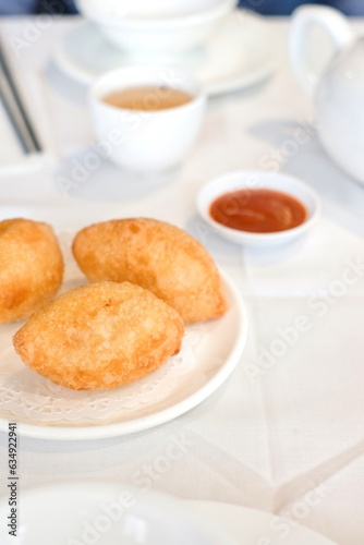 Ham sui gok: deep-fried glutinous rice dumplings filled with prawn and barbecued pork at a yum cha restaurant in Burwood Chinatown — Sydney, Australia photo