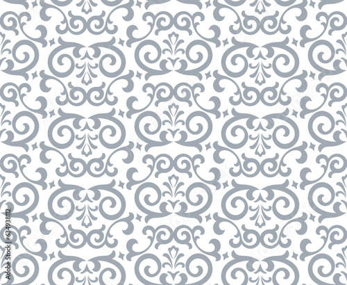 Wallpaper in the style of Baroque. Seamless vector background. White and gray floral ornament. Graphic pattern for fabric, wallpaper, packaging. Ornate Damask flower ornament.