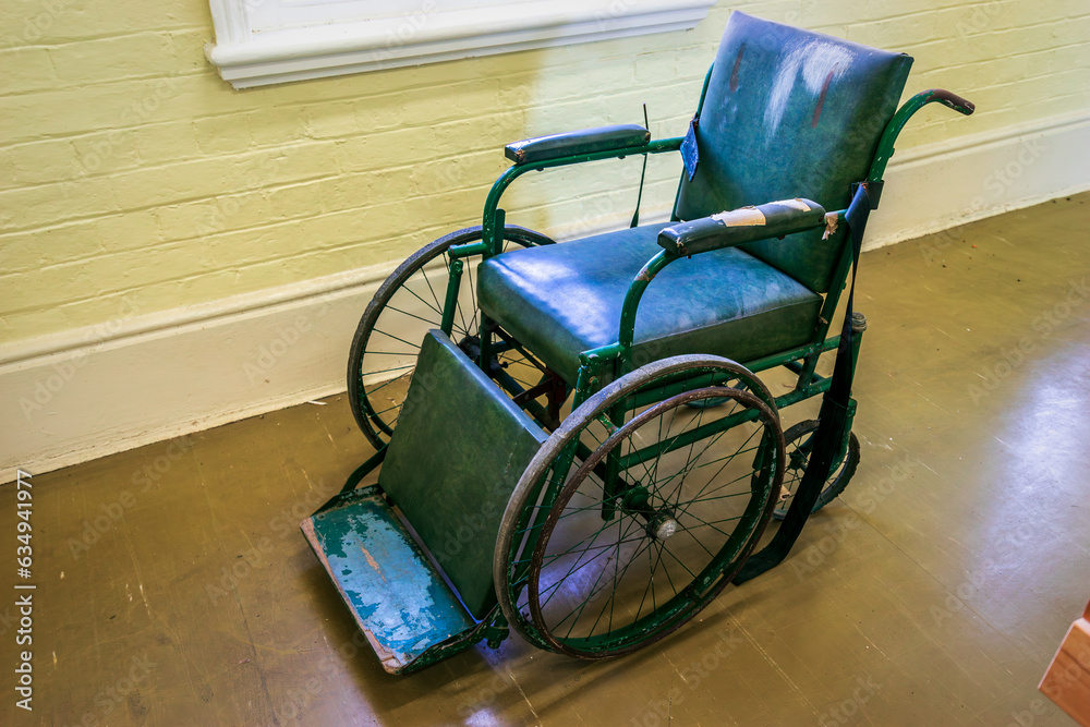 Old dilapidated disabled wheel chair