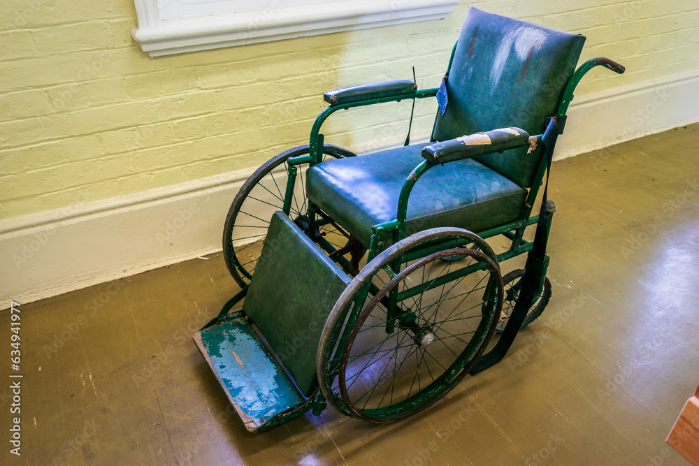 Old dilapidated disabled wheel chair Old dilapidated disabled wheel chair