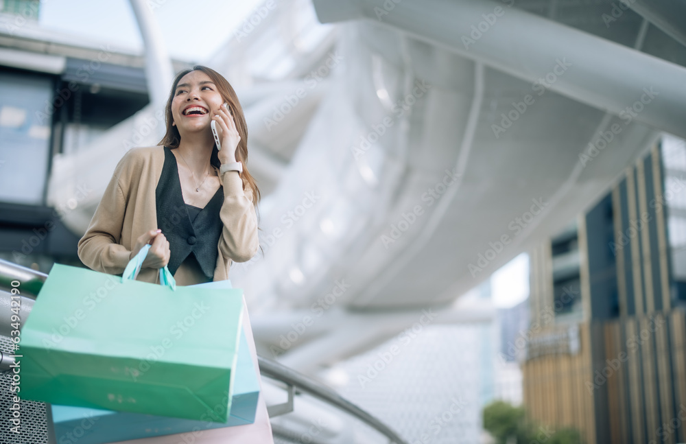 Stylish lady strolls downtown, explores new stores, and smiles while enjoying chic weekend shopping Stylish lady strolls downtown, explores new stores, and smiles while enjoying chic weekend shopping