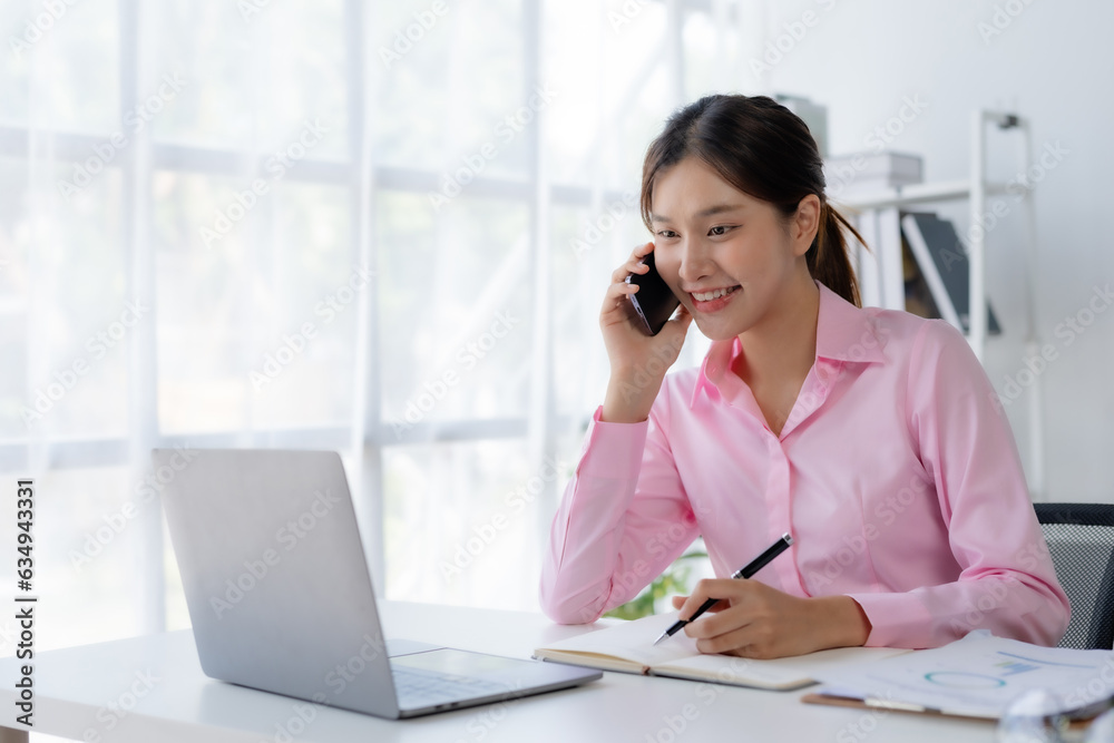 Asian businesswoman modern professional talking with client on the phone with a confident demeanor and effective communication skill. business, marketing, sale and communication project.