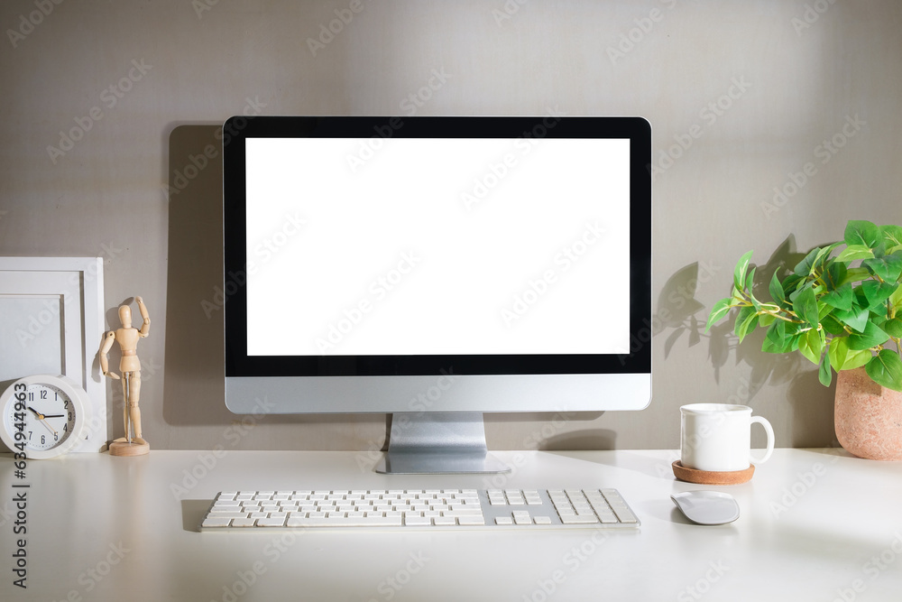 Minimal workspace with white screen computer and office supplies on white table. Minimal workspace with white screen computer and office supplies on white table.