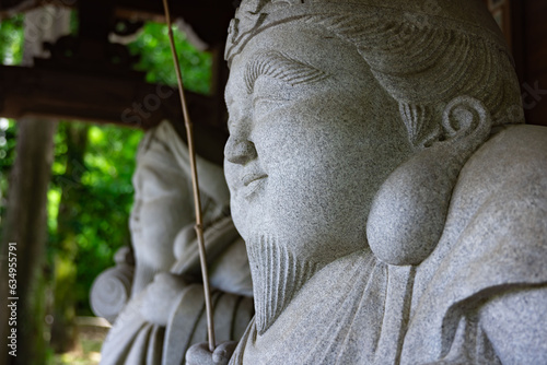 Japanese guardian statues at the traditional street in Tokyo photo